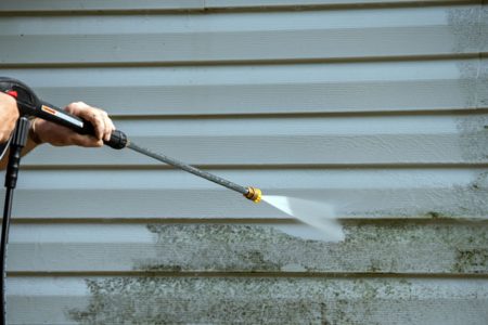 An,Unidentified,Man,Uses,A,Power,Washer,To,Clean,Mold An,Unidentified,Man,Uses,A,Power,Washer,To,Clean,Mold